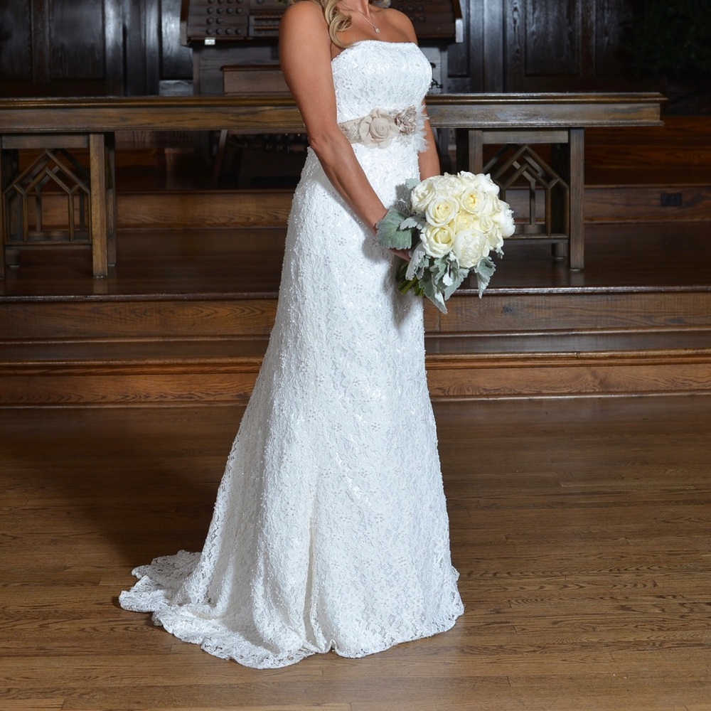 Custom Wedding gown was cleaned and has been boxed and sealed since worn.